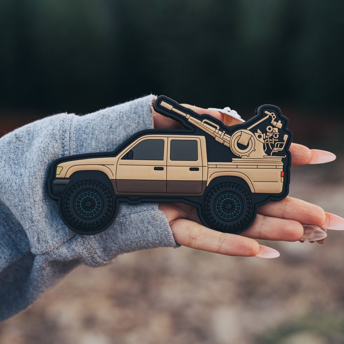 PVC Hilux patch featuring bold lettering and a rugged truck design, symbolizing durability and adventure for enthusiasts.